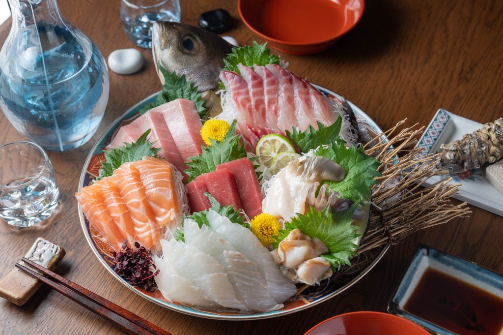 Authentic japanese sashimi platter with sake